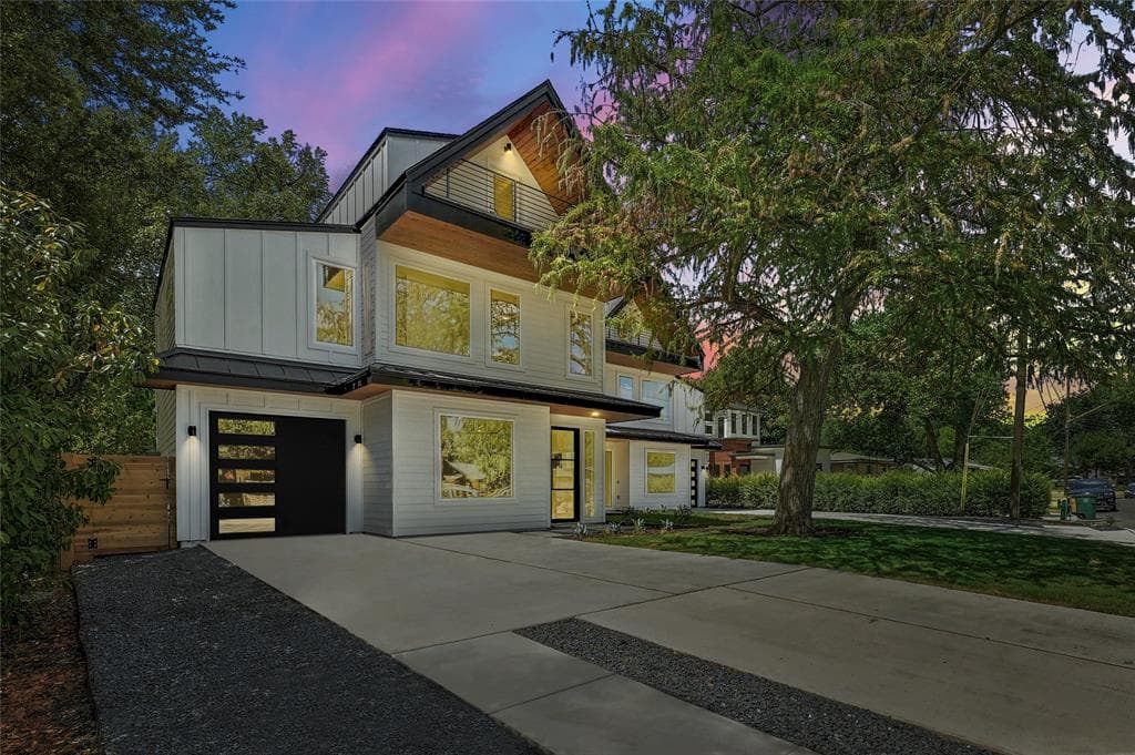 Oak Forest Modern Homes exterior at dusk