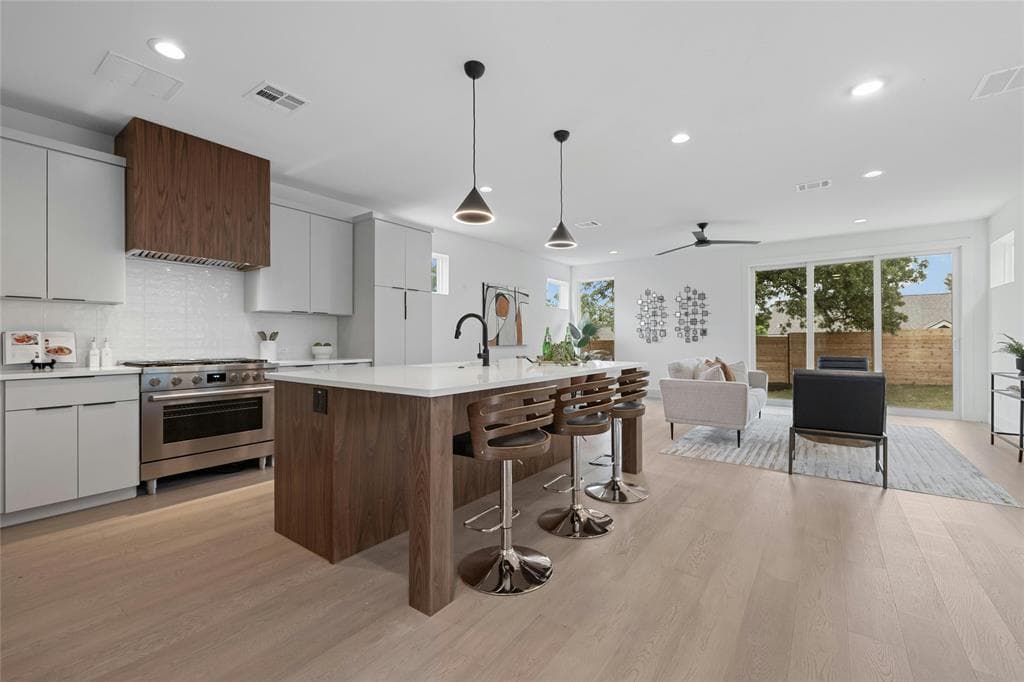 Kitchen detail showing quartz waterfall countertop and zellige backsplash